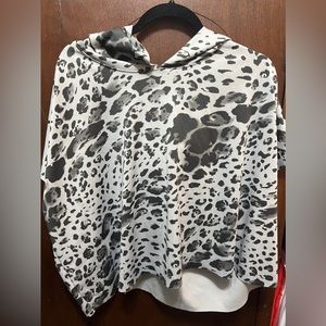 Cheetah print top. Very light and has a hood on it